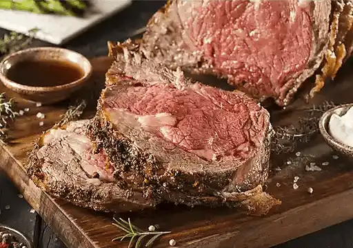 Peppered Rib Eye Roast with roasted garlic